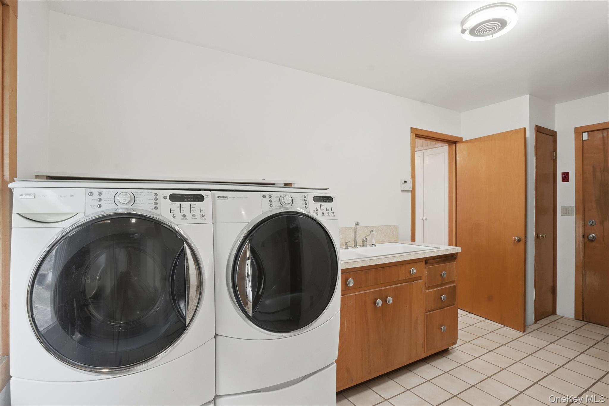 435 Samsonville Road Kerhonkson, NY 12446 - Photo 16 of 37 a utility room with sink dryer and washer