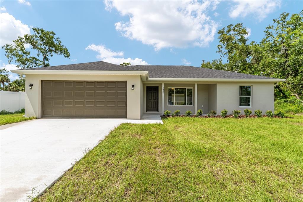 34 Cypress Road Ocala, FL 34472 - Photo 1 of 1 a front view of house with yard
