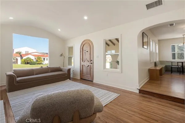 a large kitchen with a table and chairs