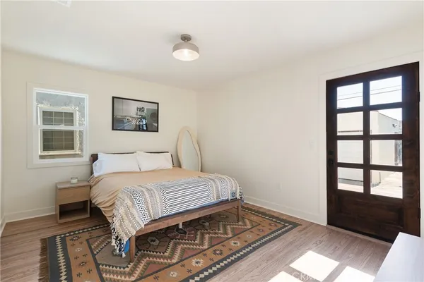 a bedroom with a bed and a dresser
