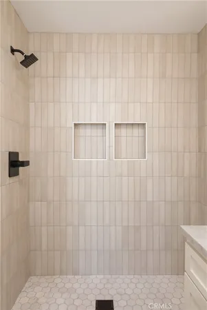 a bathroom with a granite countertop sink mirror and toilet