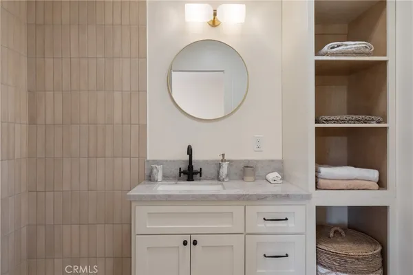 a bathroom with a shower and a sink