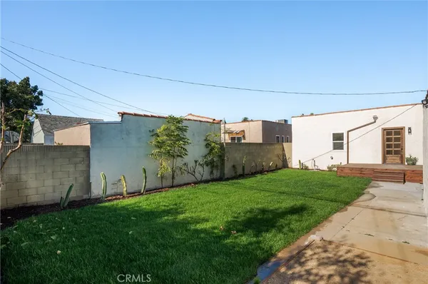 a view of a backyard with sitting area