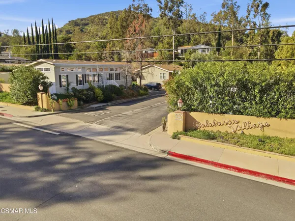 an aerial view of a houses with yard
