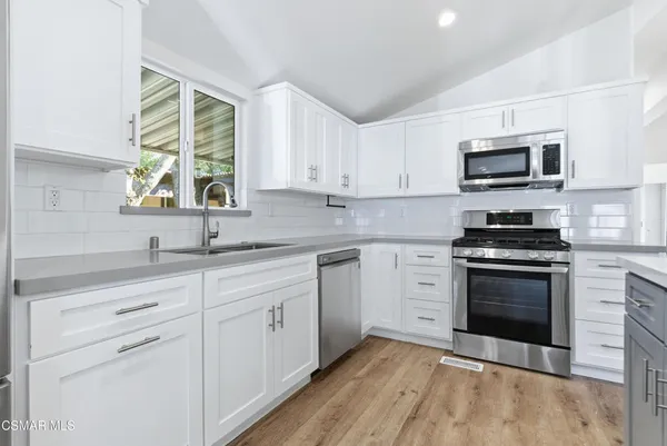 a view of kitchen with wooden floor