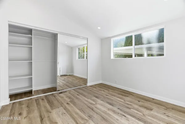 a bathroom with a shower and a glass door