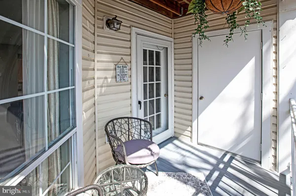 a front view of a house with outdoor seating