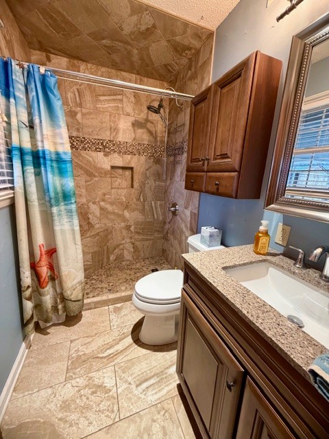 43 Liberty Road Winchester, TN 37398 - Photo 14 of 27 a bathroom with a granite countertop sink toilet and shower
