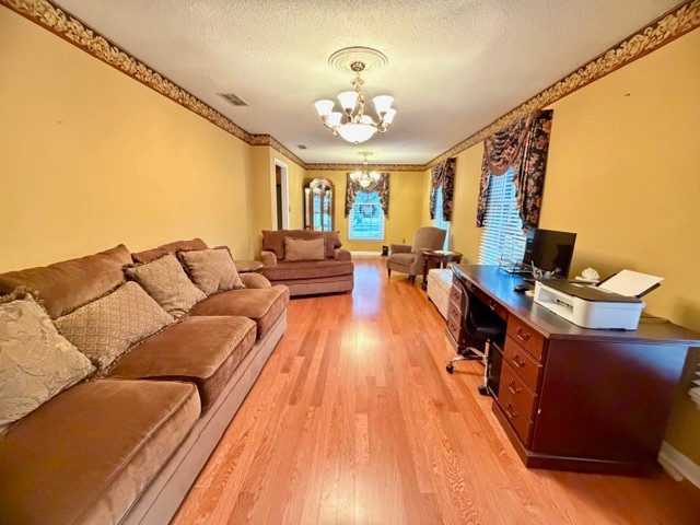 43 Liberty Road Winchester, TN 37398 - Photo 7 of 27 a living room with furniture and a chandelier