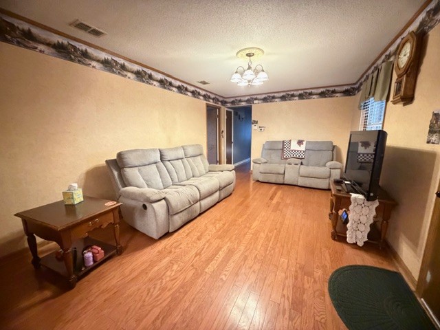 43 Liberty Road Winchester, TN 37398 - Photo 8 of 27 a living room with furniture and a chandelier