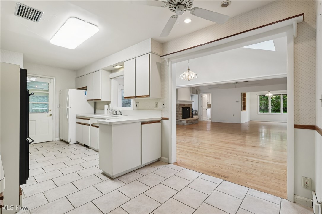 33300 South Woodland Road Cleveland, OH 44124 - Photo 21 of 50 Kitchen featuring white cabinetry, light countertops, a ceiling fan, and recessed lighting