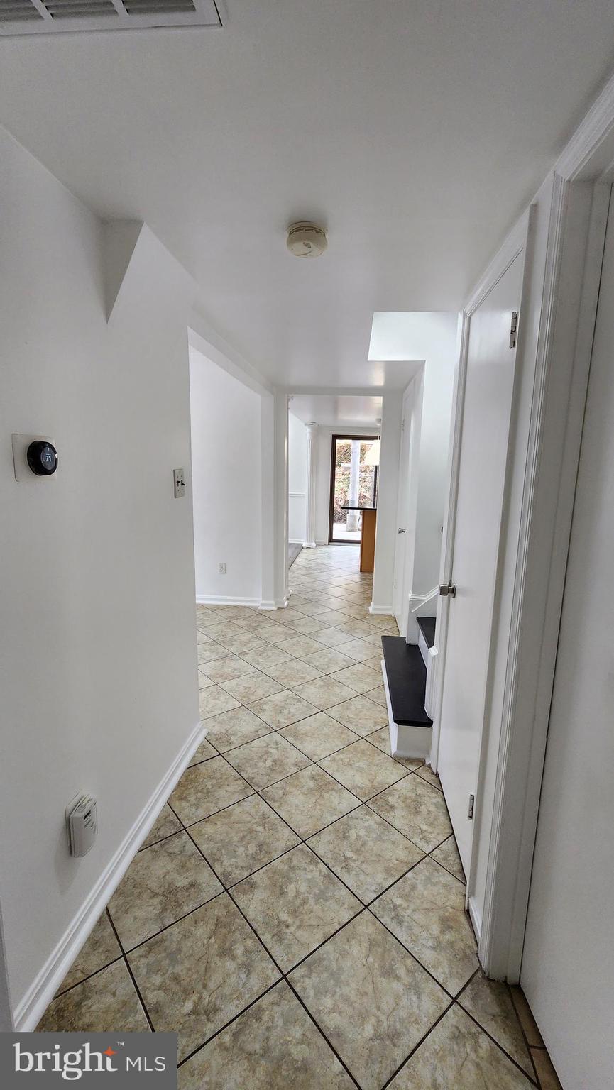 8438 Thames Street Springfield, VA 22151 - Photo 20 of 67 Lower level hallway - view from garage