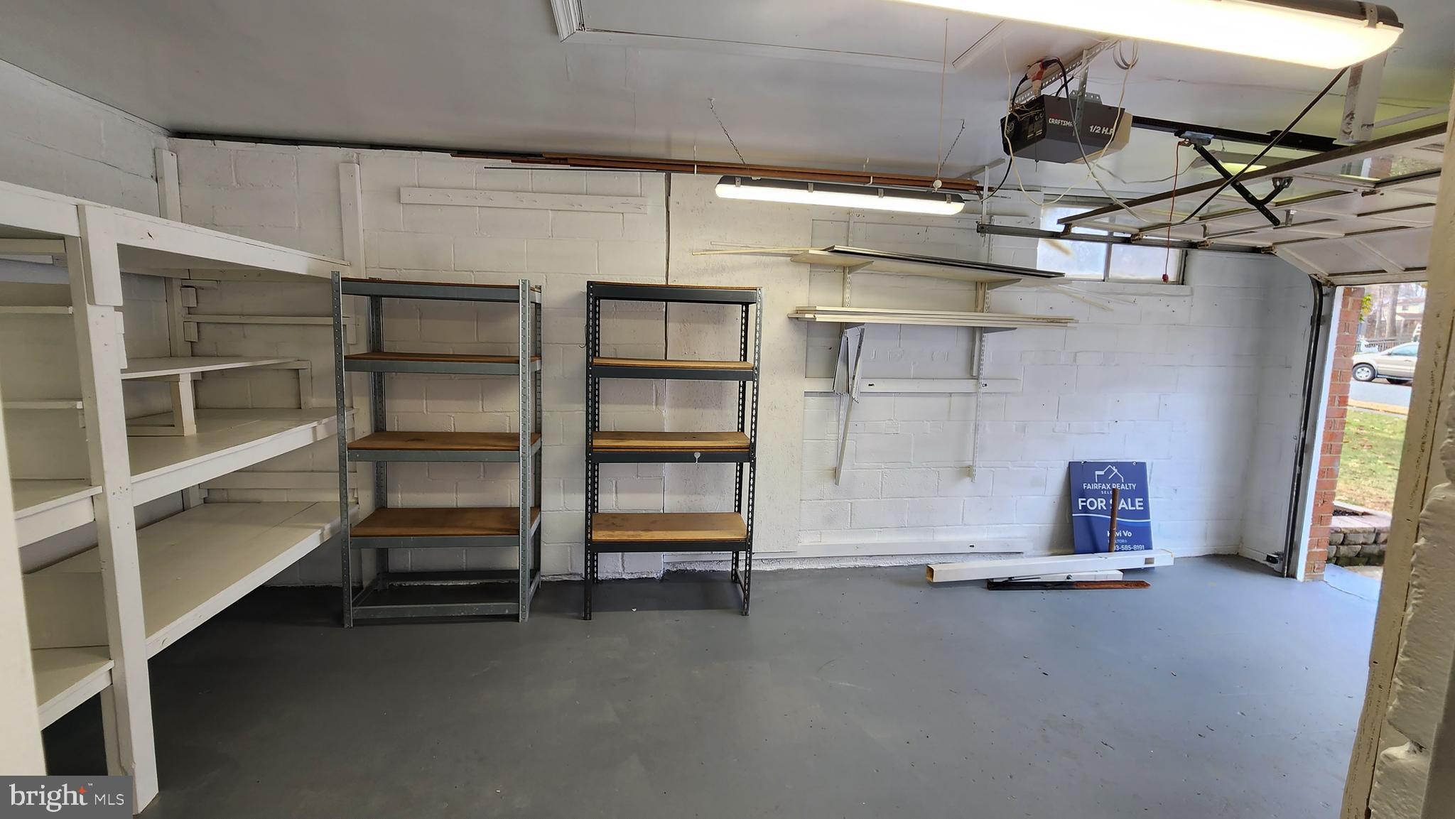 8438 Thames Street Springfield, VA 22151 - Photo 56 of 67 Garage and shelving - view 1