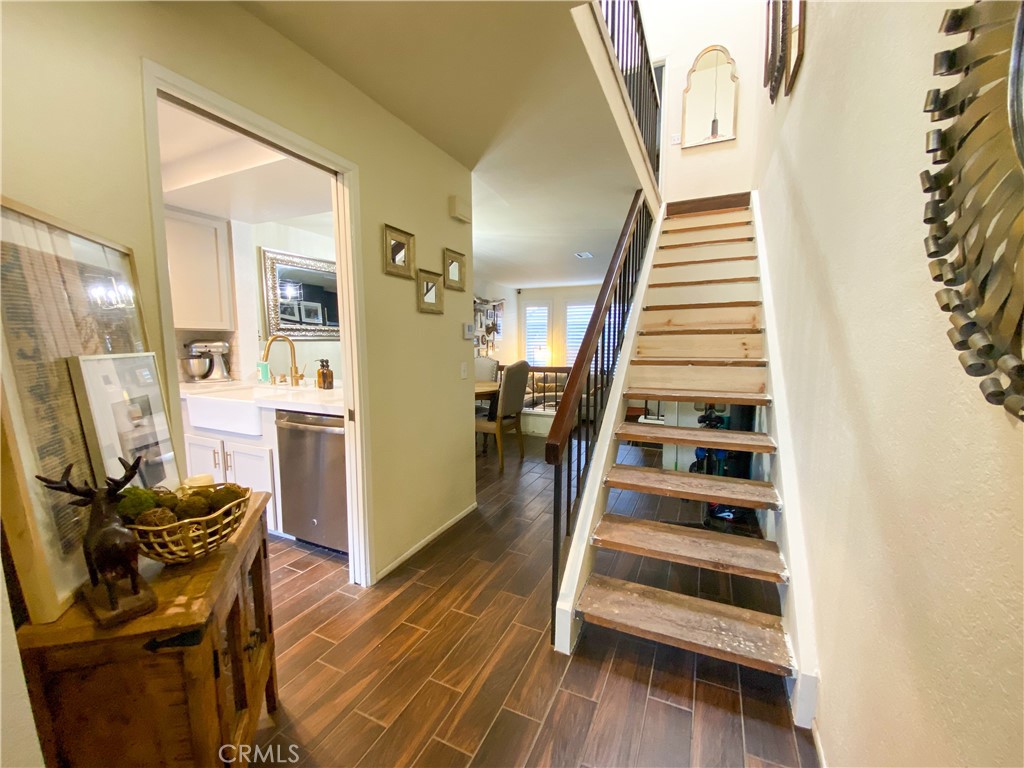 1087 Mesa Bluff Drive Costa Mesa, CA 92627 - Photo 14 of 23 a view of entryway and hall with wooden floor