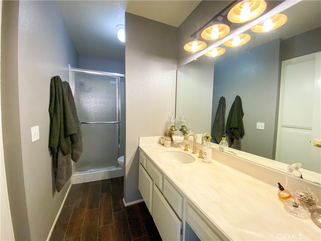 1087 Mesa Bluff Drive Costa Mesa, CA 92627 - Photo 18 of 23 a bathroom with a double vanity sink and a mirror