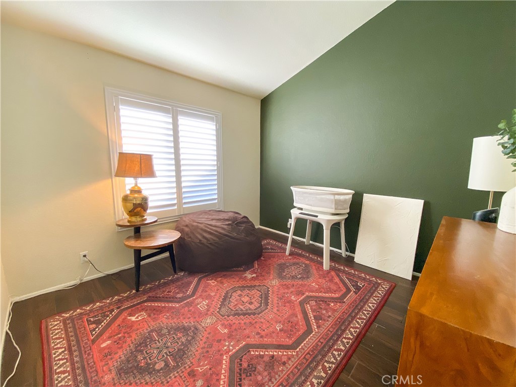 1087 Mesa Bluff Drive Costa Mesa, CA 92627 - Photo 20 of 23 a bedroom with a bed and a table in it