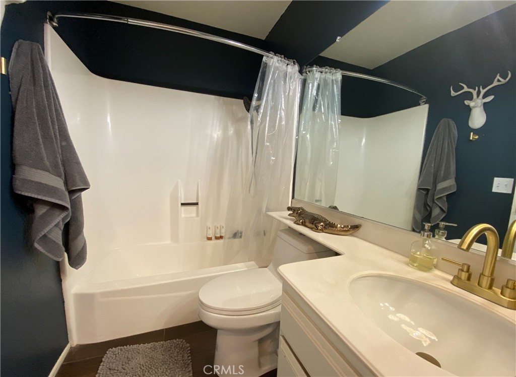 1087 Mesa Bluff Drive Costa Mesa, CA 92627 - Photo 21 of 23 a bathroom with a sink a toilet and shower