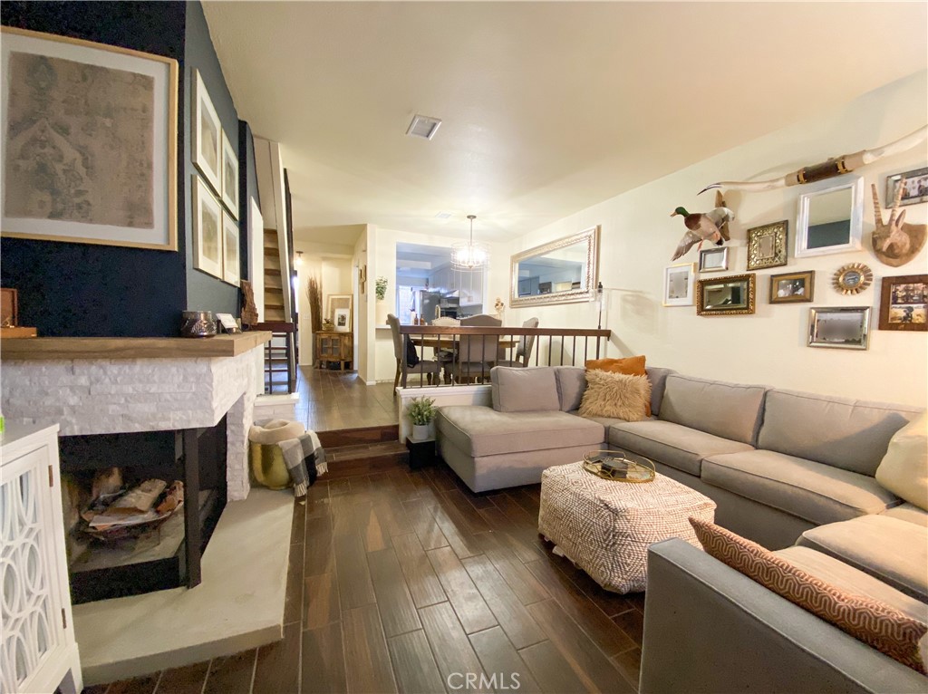 1087 Mesa Bluff Drive Costa Mesa, CA 92627 - Photo 3 of 23 a living room with furniture and a fireplace
