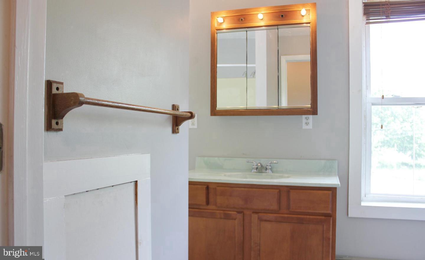 236 North Locust Street Hagerstown, MD 21740 - Photo 14 of 22 a bathroom with a sink and a window