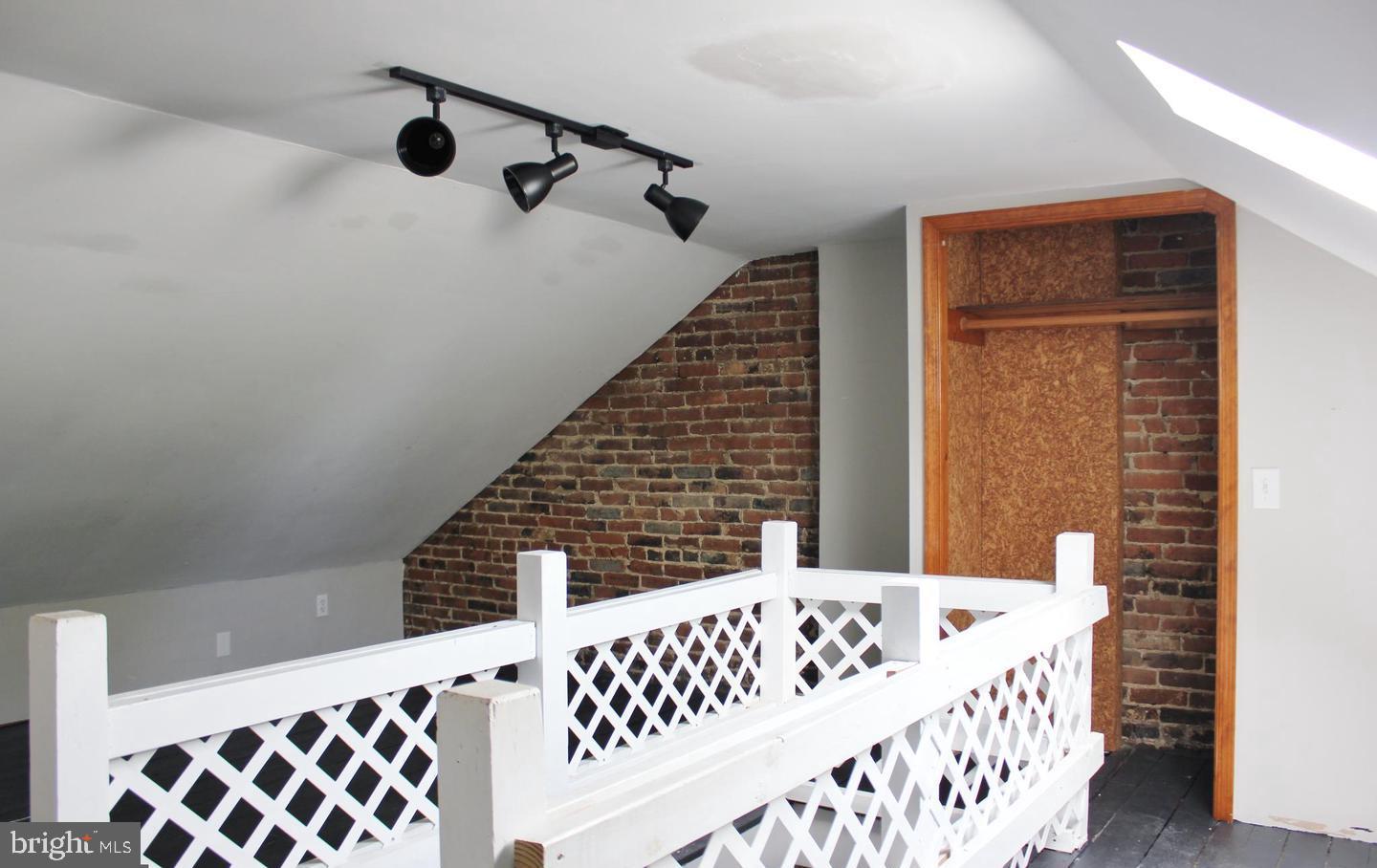 236 North Locust Street Hagerstown, MD 21740 - Photo 17 of 22 a bedroom with a bed and wooden floor