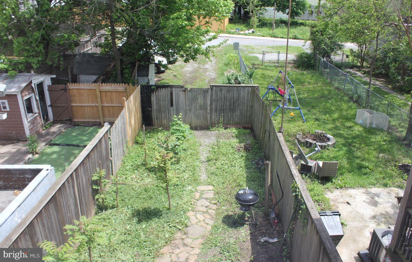 236 North Locust Street Hagerstown, MD 21740 - Photo 20 of 22 a backyard with wooden fence and some plants