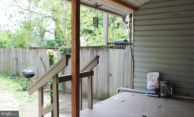 a view of staircase with a table and chairs