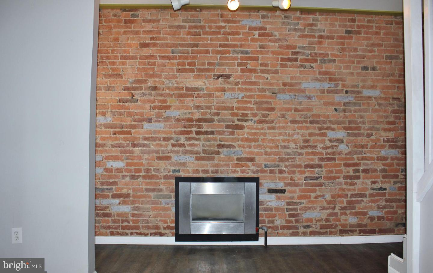 236 North Locust Street Hagerstown, MD 21740 - Photo 4 of 22 a brick oven with a fireplace