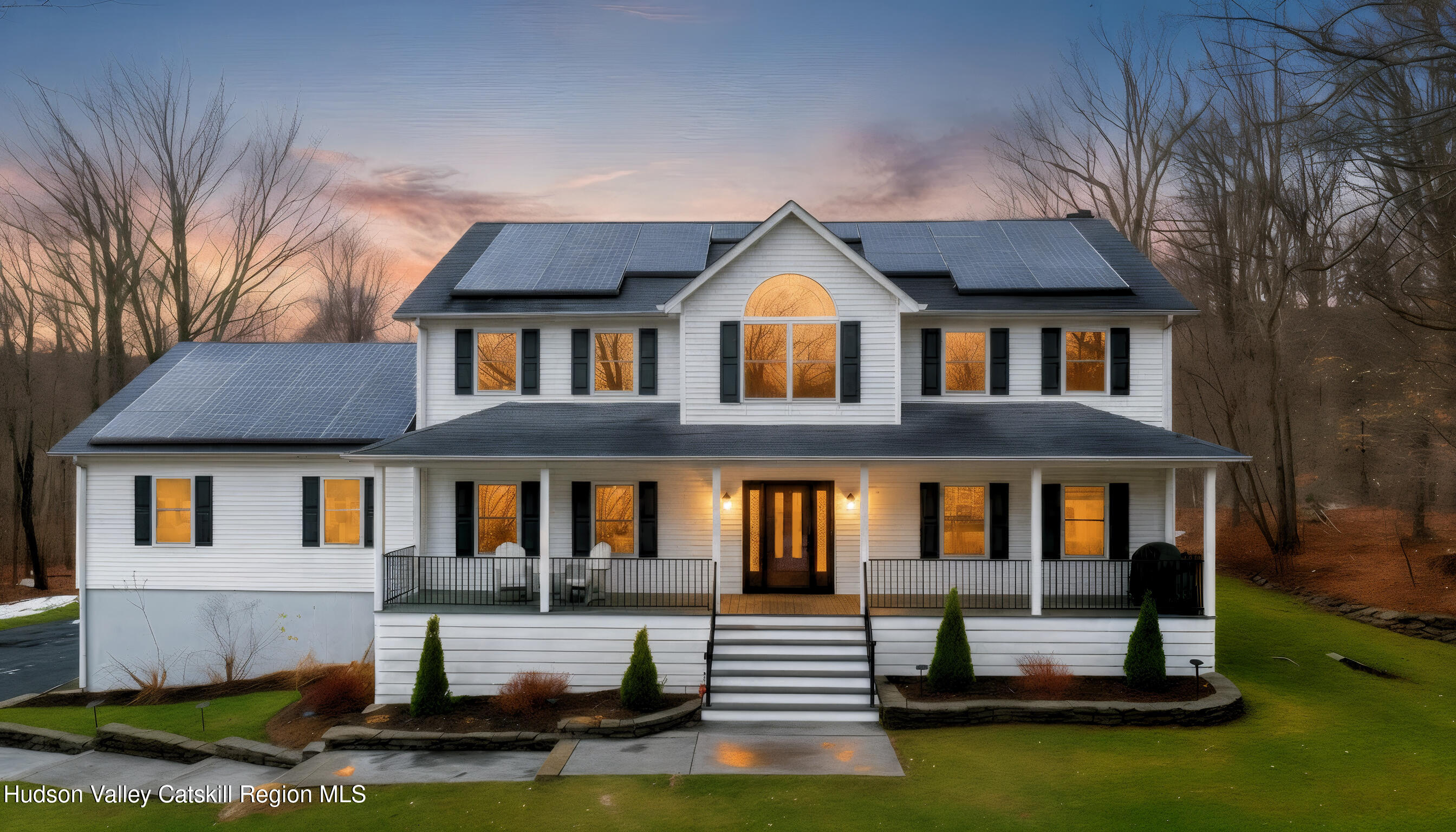 a front view of a house with swimming pool and porch