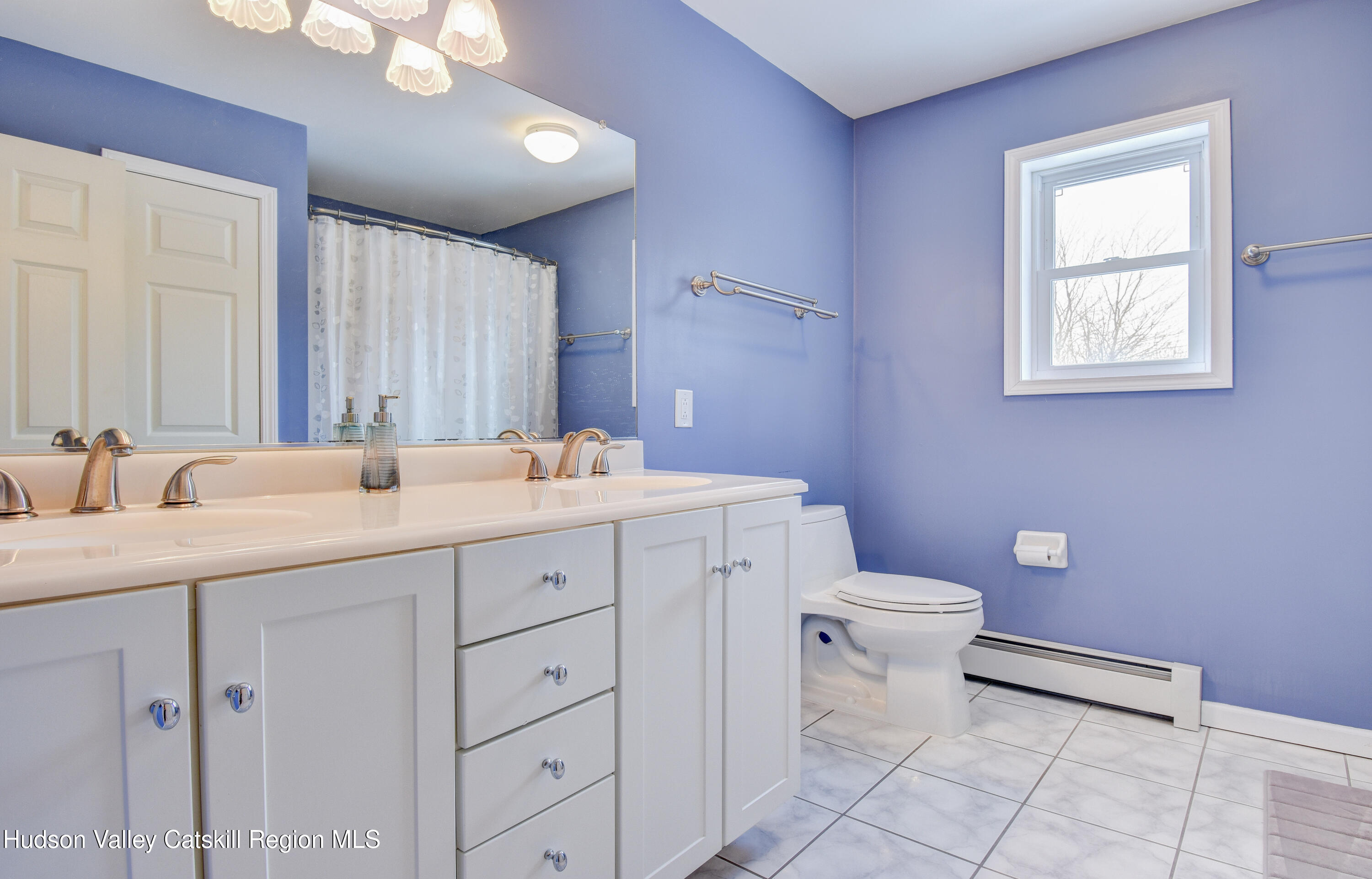 309 Quannacut Road Pine Bush, NY 12566 - Photo 12 of 43 a bathroom with a toilet sink and mirror