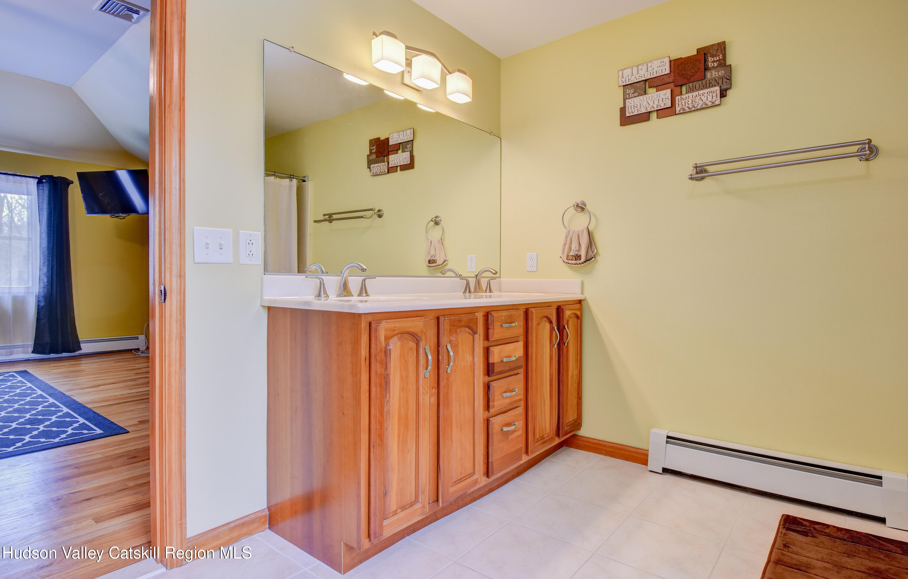 309 Quannacut Road Pine Bush, NY 12566 - Photo 18 of 43 a bathroom with a sink a mirror and a shower