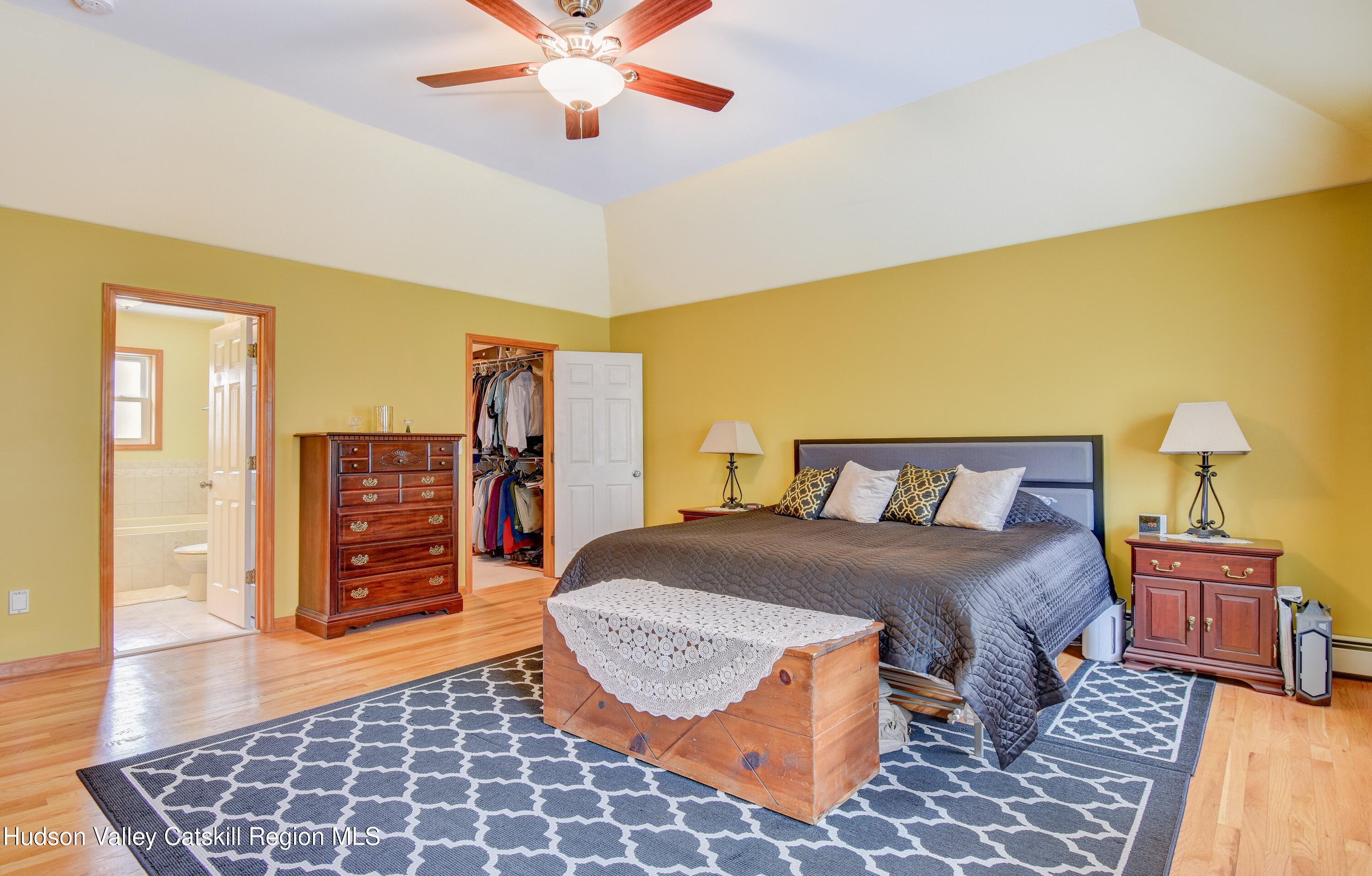 309 Quannacut Road Pine Bush, NY 12566 - Photo 22 of 43 a bedroom with a bed and wooden floor