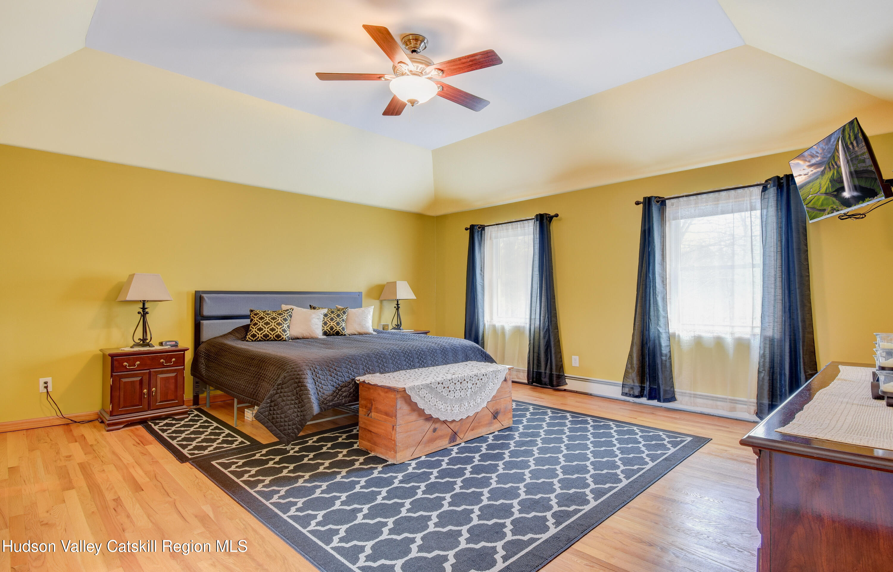 309 Quannacut Road Pine Bush, NY 12566 - Photo 23 of 43 a bedroom with a bed and wooden floor