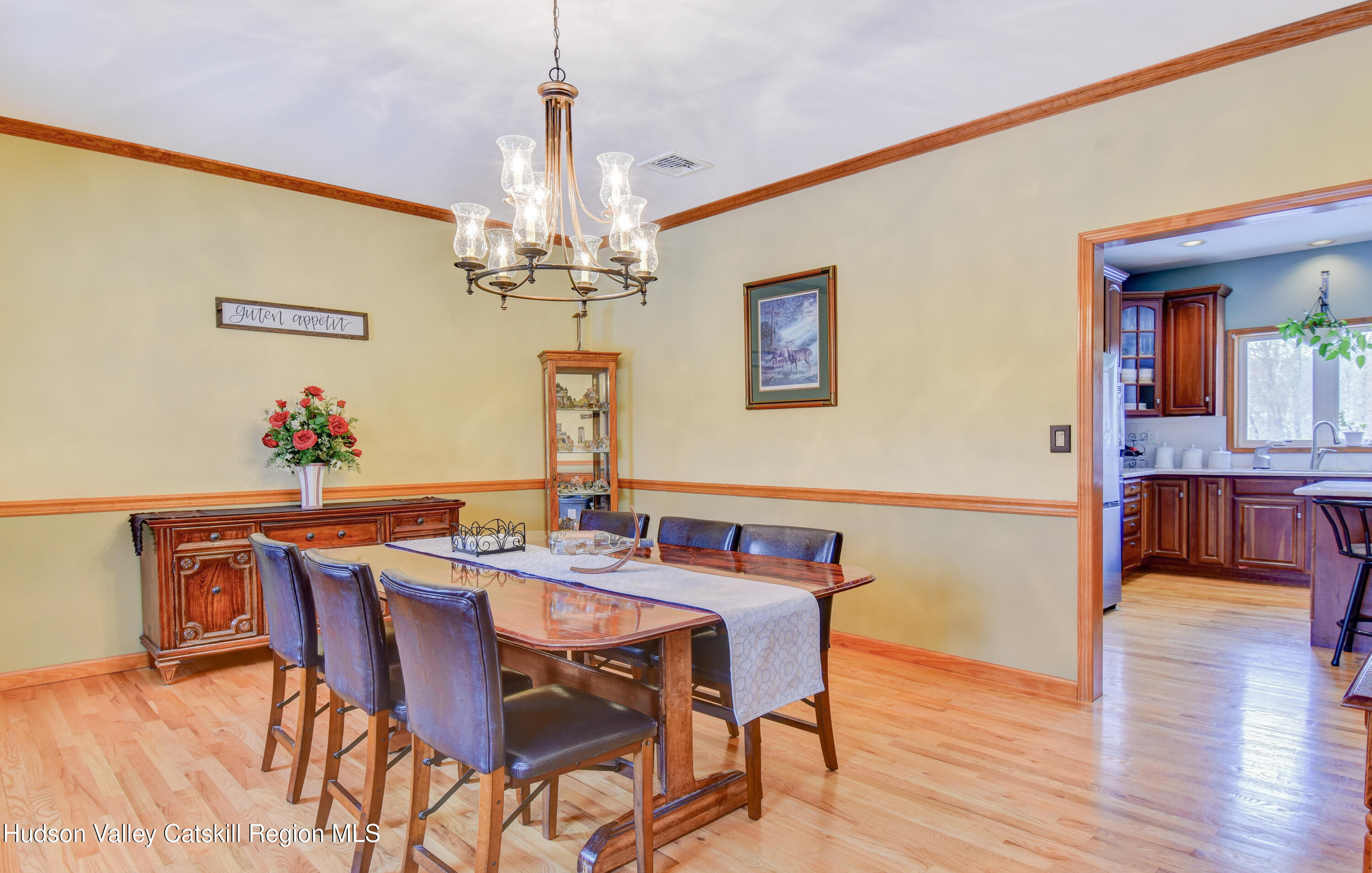 309 Quannacut Road Pine Bush, NY 12566 - Photo 26 of 43 a view of a dining room with furniture and wooden floor