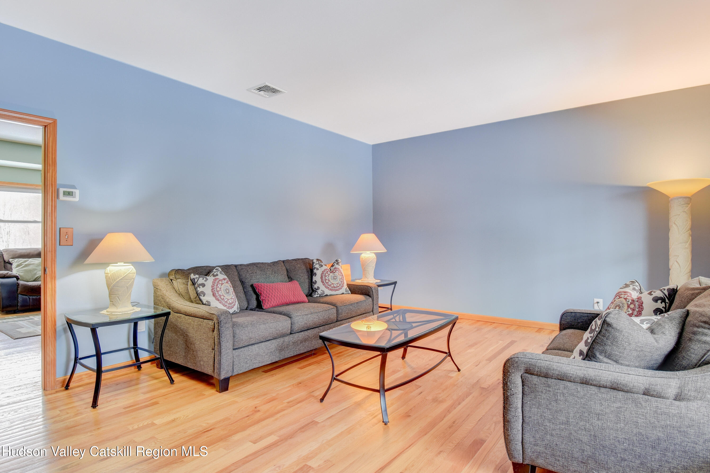 309 Quannacut Road Pine Bush, NY 12566 - Photo 28 of 43 a living room with furniture and a lamp