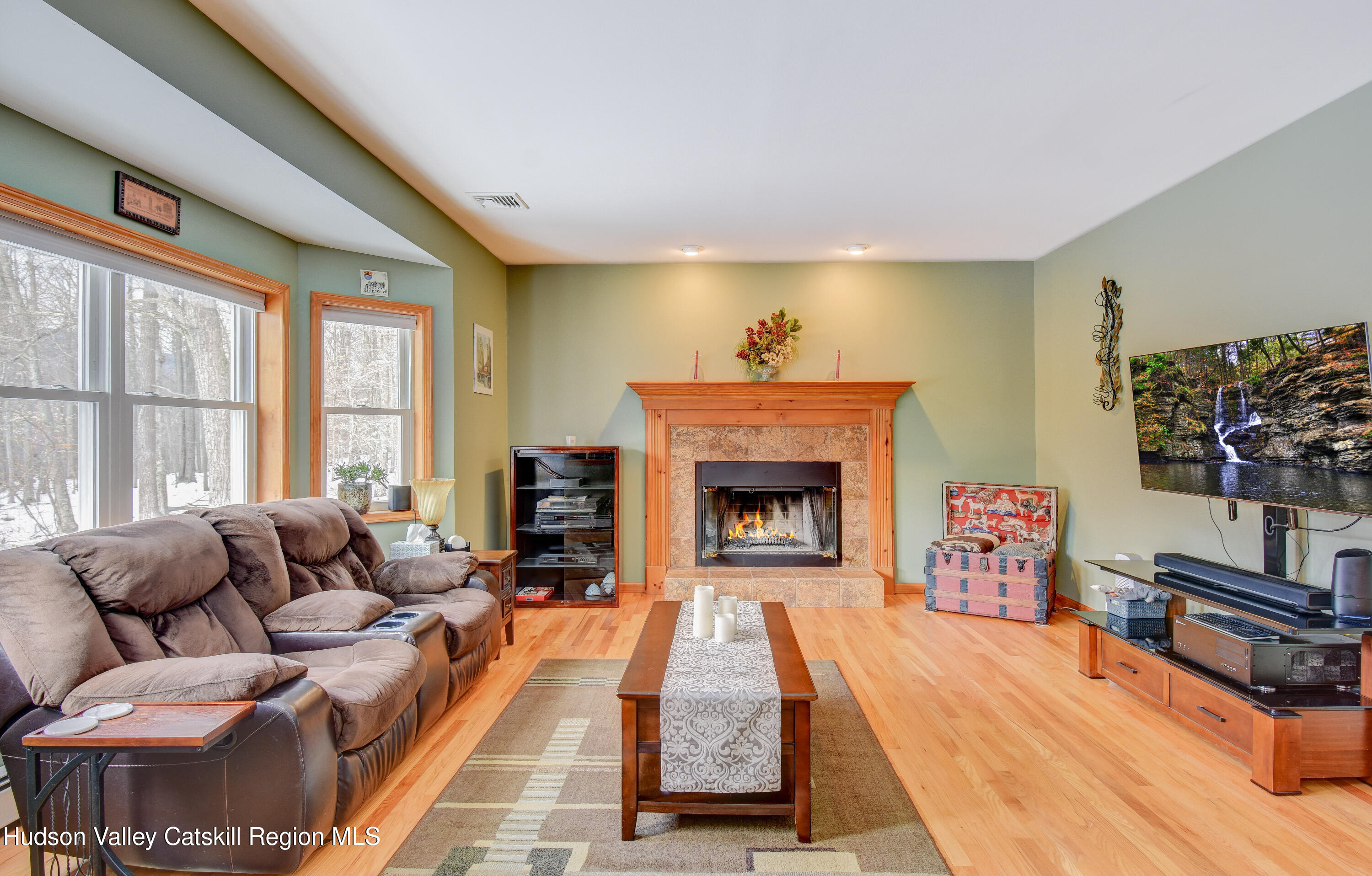 309 Quannacut Road Pine Bush, NY 12566 - Photo 33 of 43 a living room with furniture and a fireplace