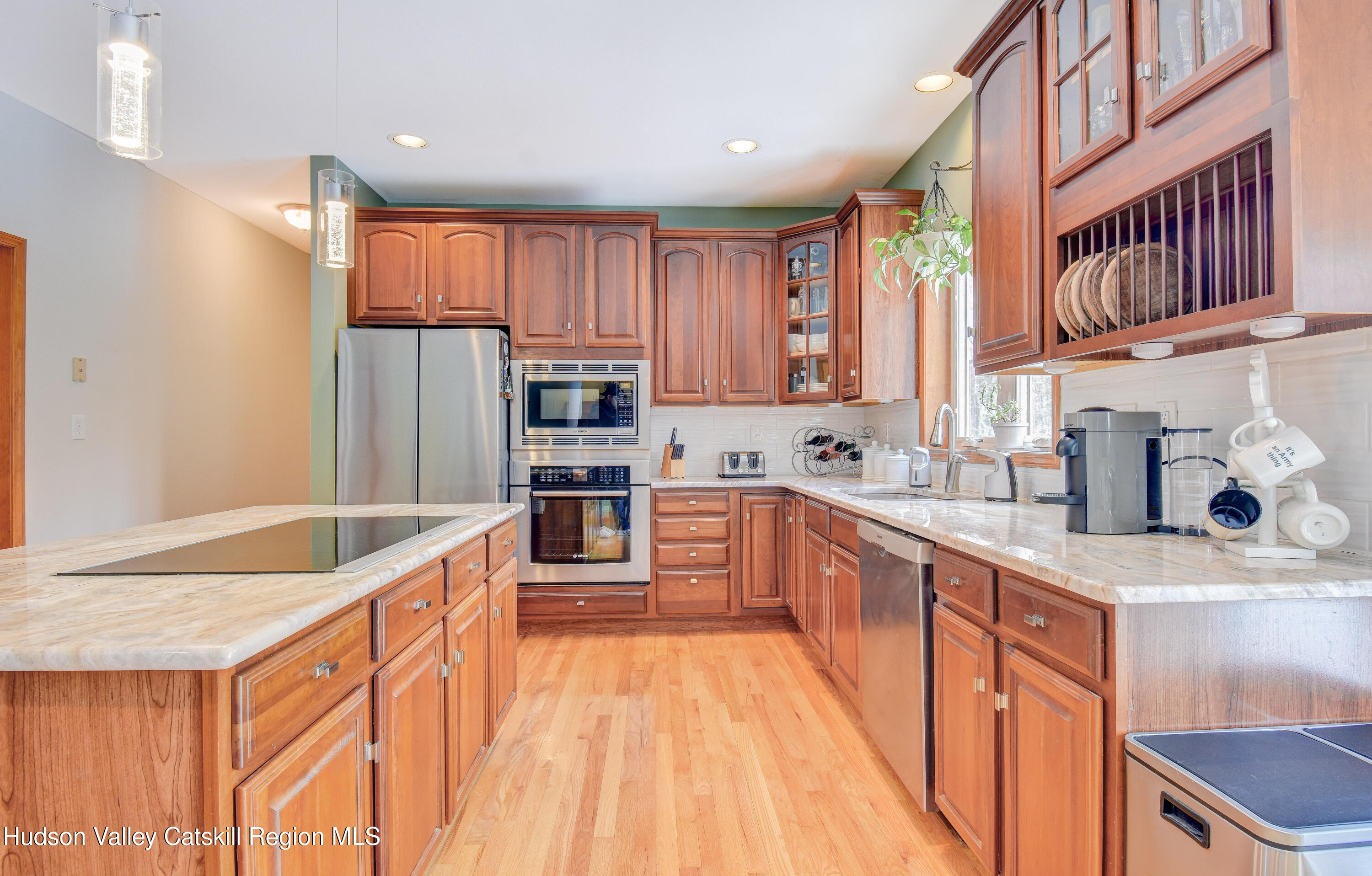 309 Quannacut Road Pine Bush, NY 12566 - Photo 37 of 43 a kitchen with stainless steel appliances granite countertop a refrigerator sink and cabinets