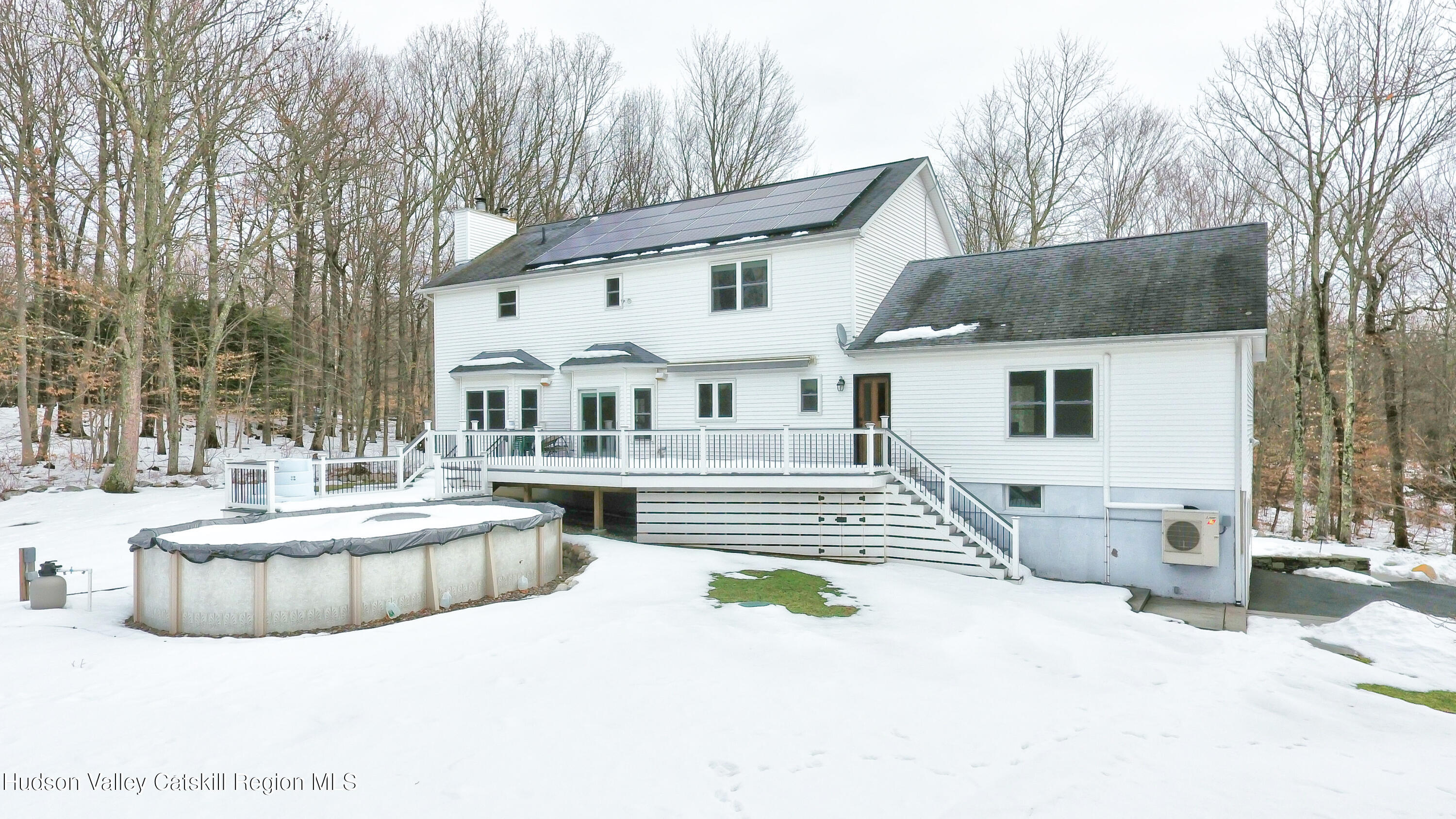 309 Quannacut Road Pine Bush, NY 12566 - Photo 4 of 43 a front view of a house with a yard outdoor seating and barbeque oven