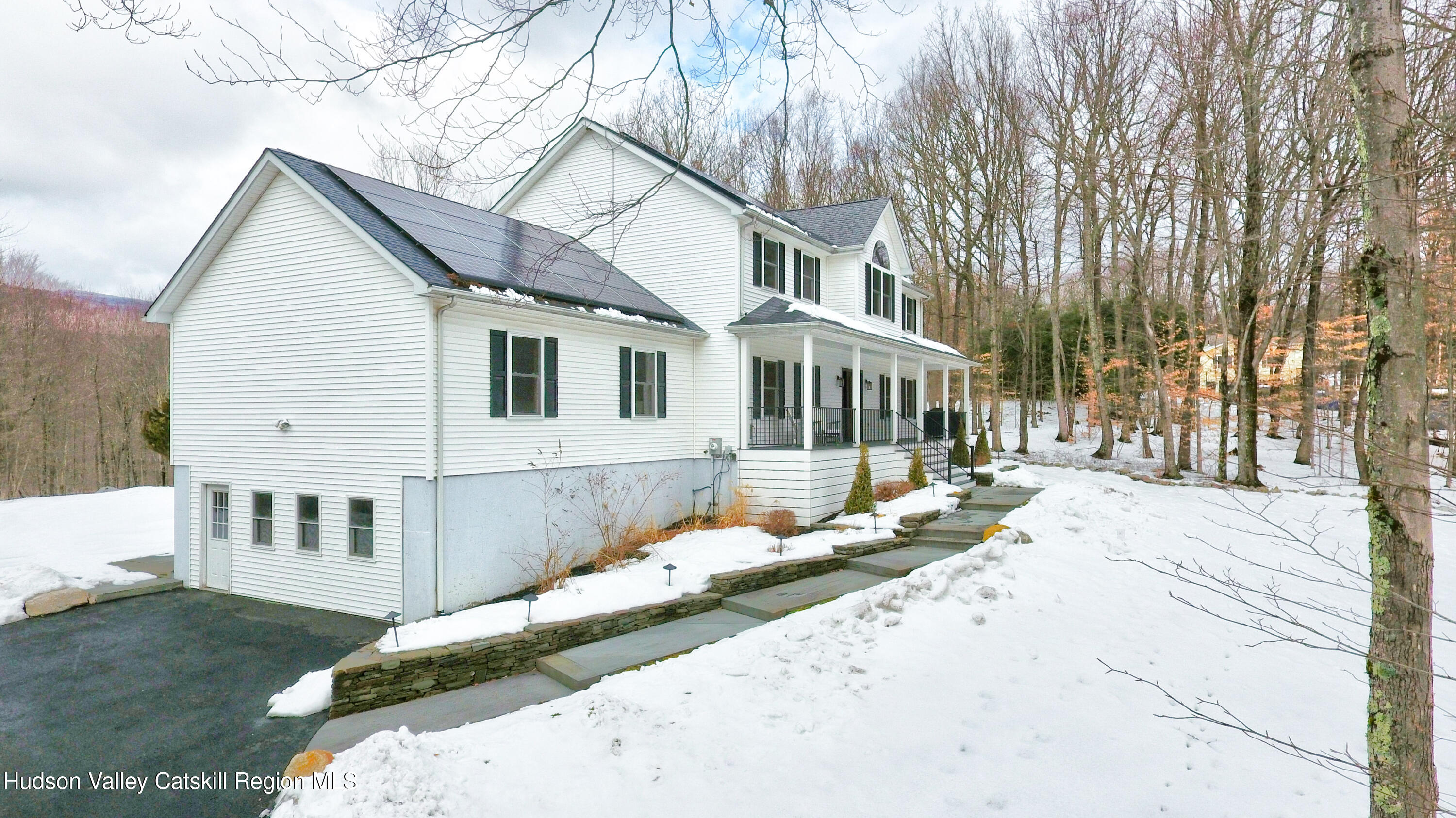 309 Quannacut Road Pine Bush, NY 12566 - Photo 42 of 43 a view of a white house with a yard and wooden fence