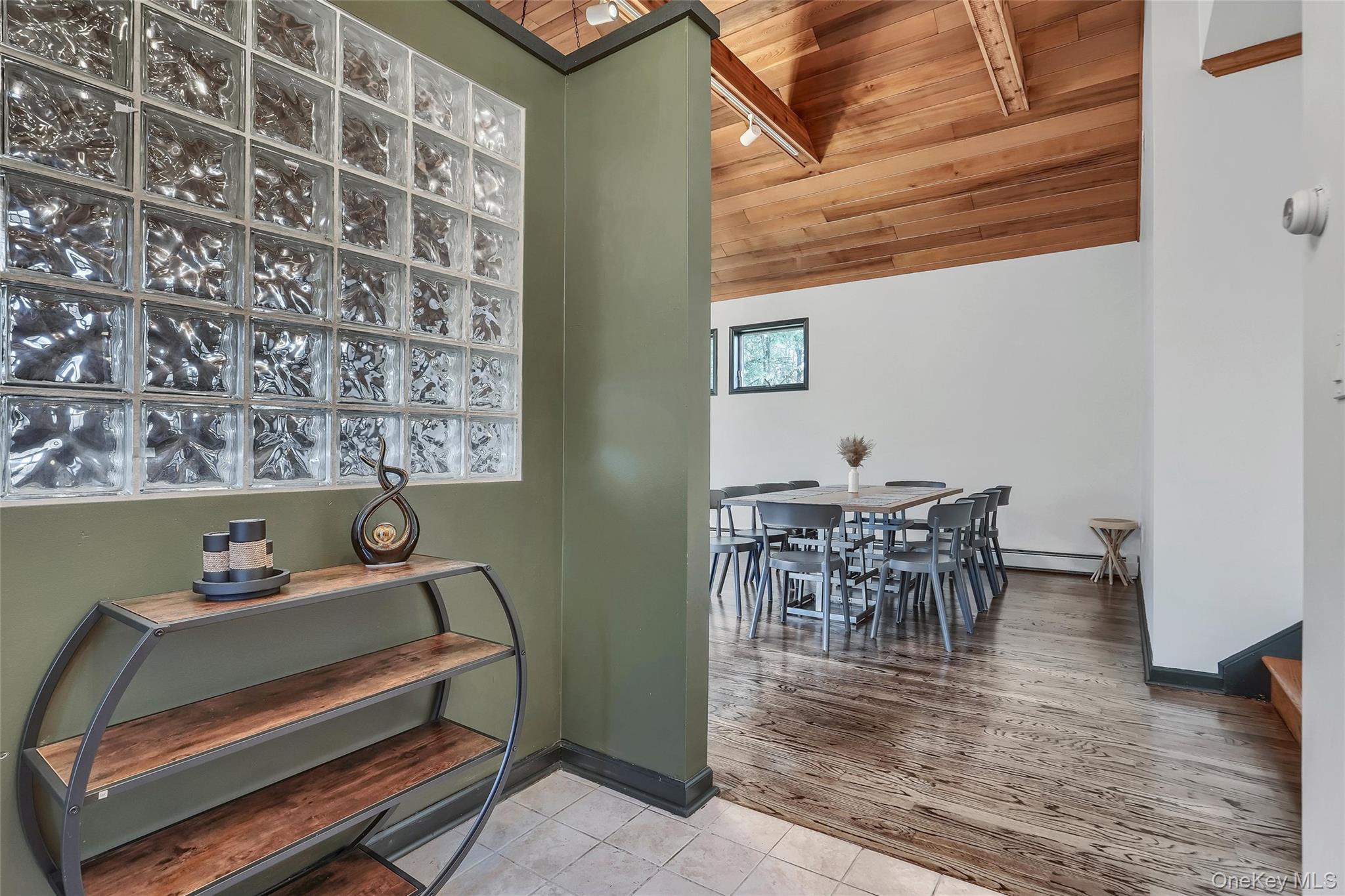 283 Prospect Road Monroe, NY 10950 - Photo 11 of 26 a dining room with furniture and wooden floor
