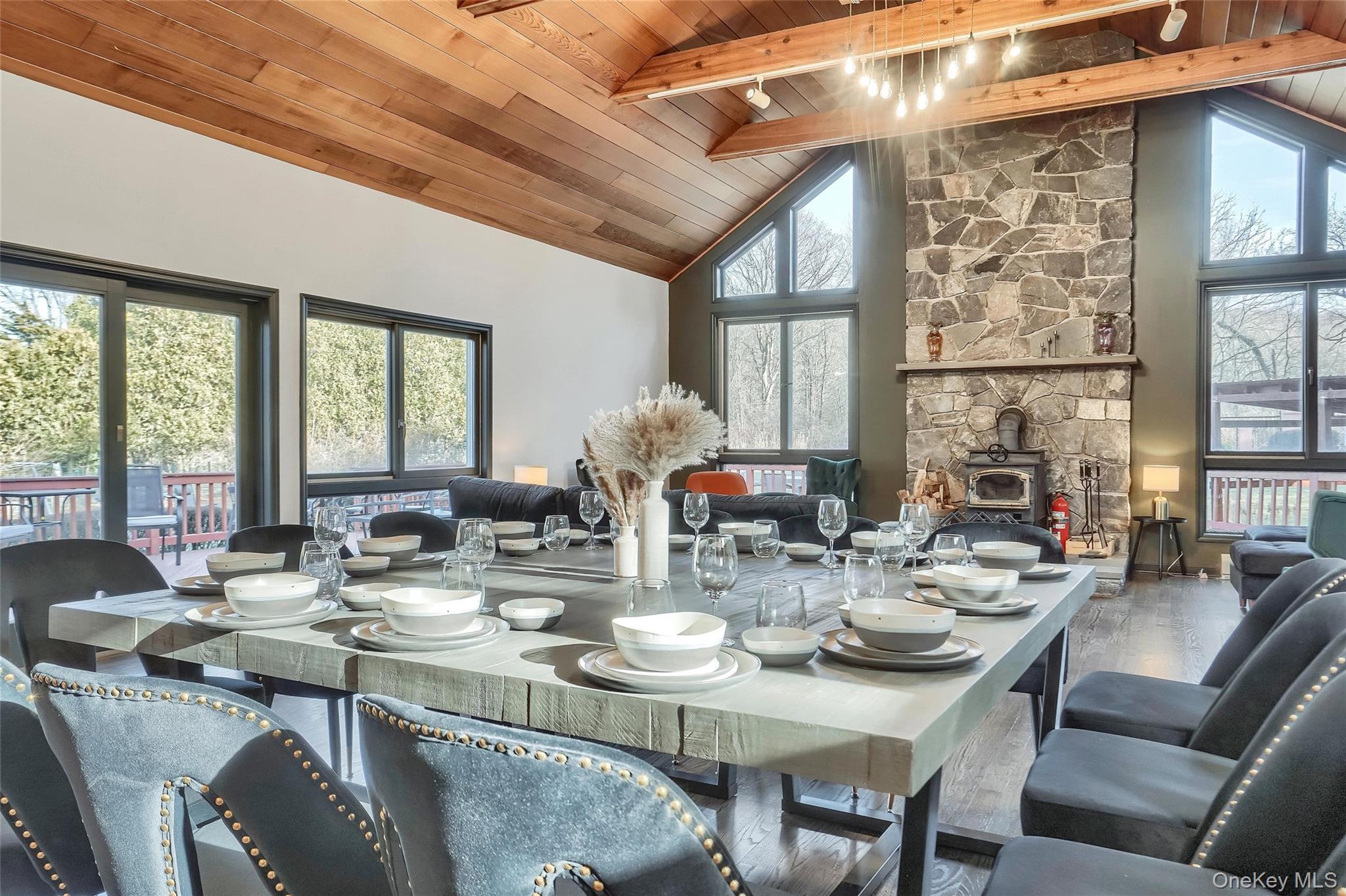 283 Prospect Road Monroe, NY 10950 - Photo 12 of 26 a view of a dining room with furniture large windows and wooden floor