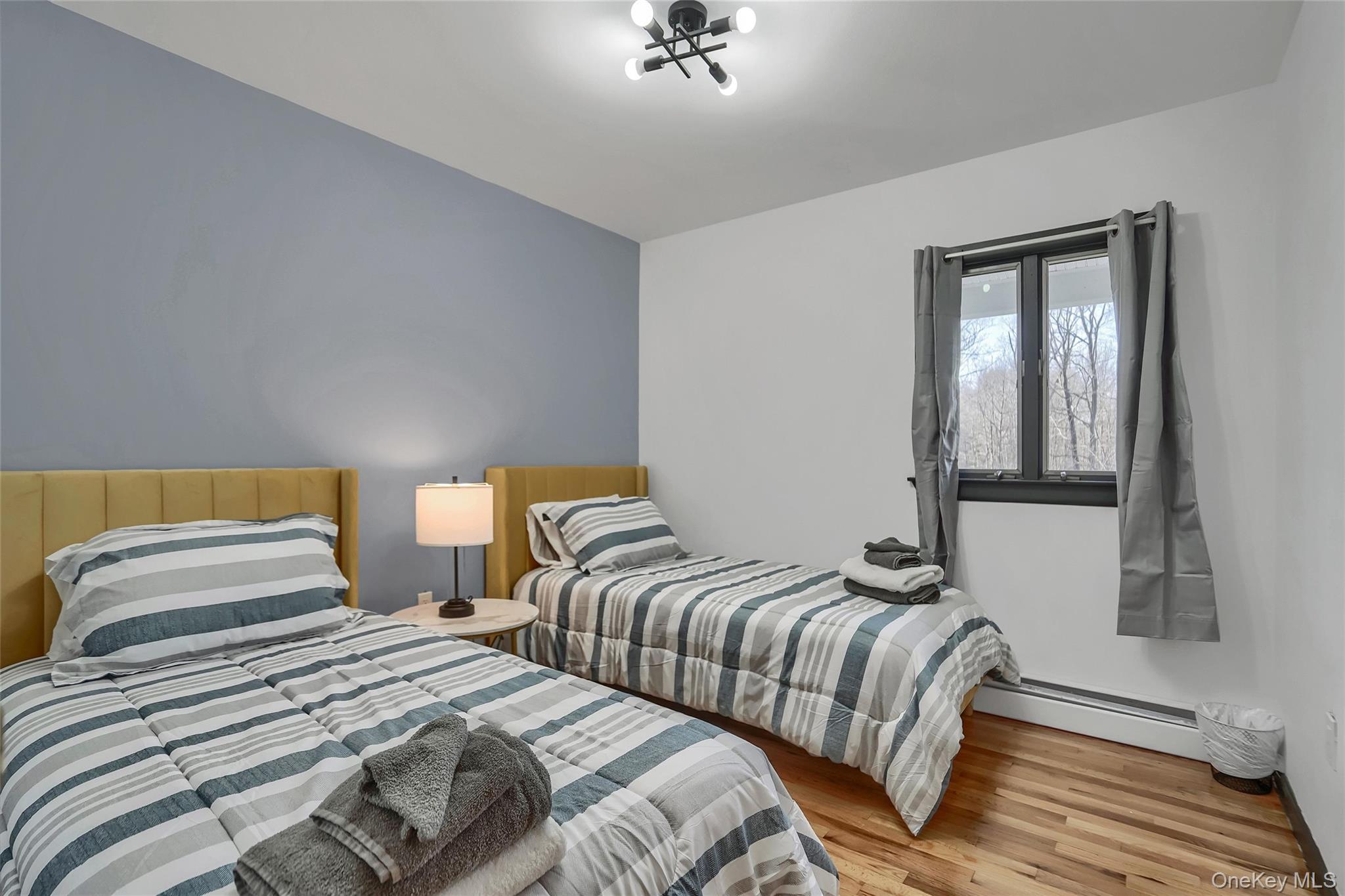 283 Prospect Road Monroe, NY 10950 - Photo 25 of 26 a bedroom with two beds and painting on the wall