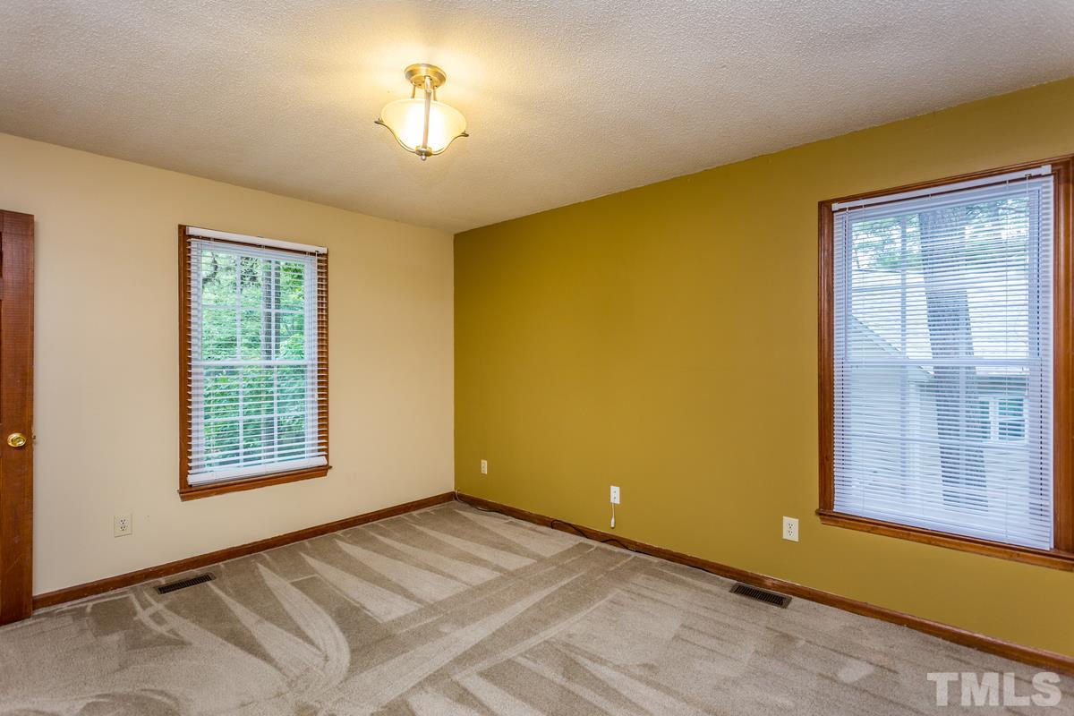 6908 Sandringham Drive Raleigh, NC 27613 - Photo 15 of 21 a view of a room with a large window