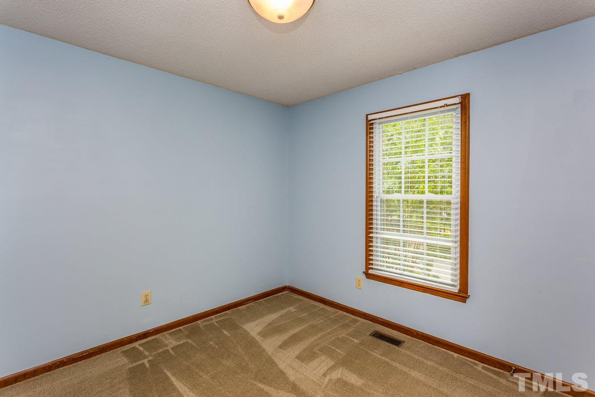6908 Sandringham Drive Raleigh, NC 27613 - Photo 16 of 21 a view of a room with a window