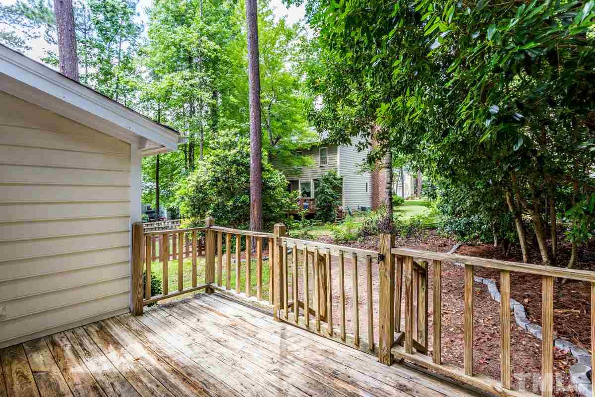 6908 Sandringham Drive Raleigh, NC 27613 - Photo 18 of 21 a view of a wooden deck