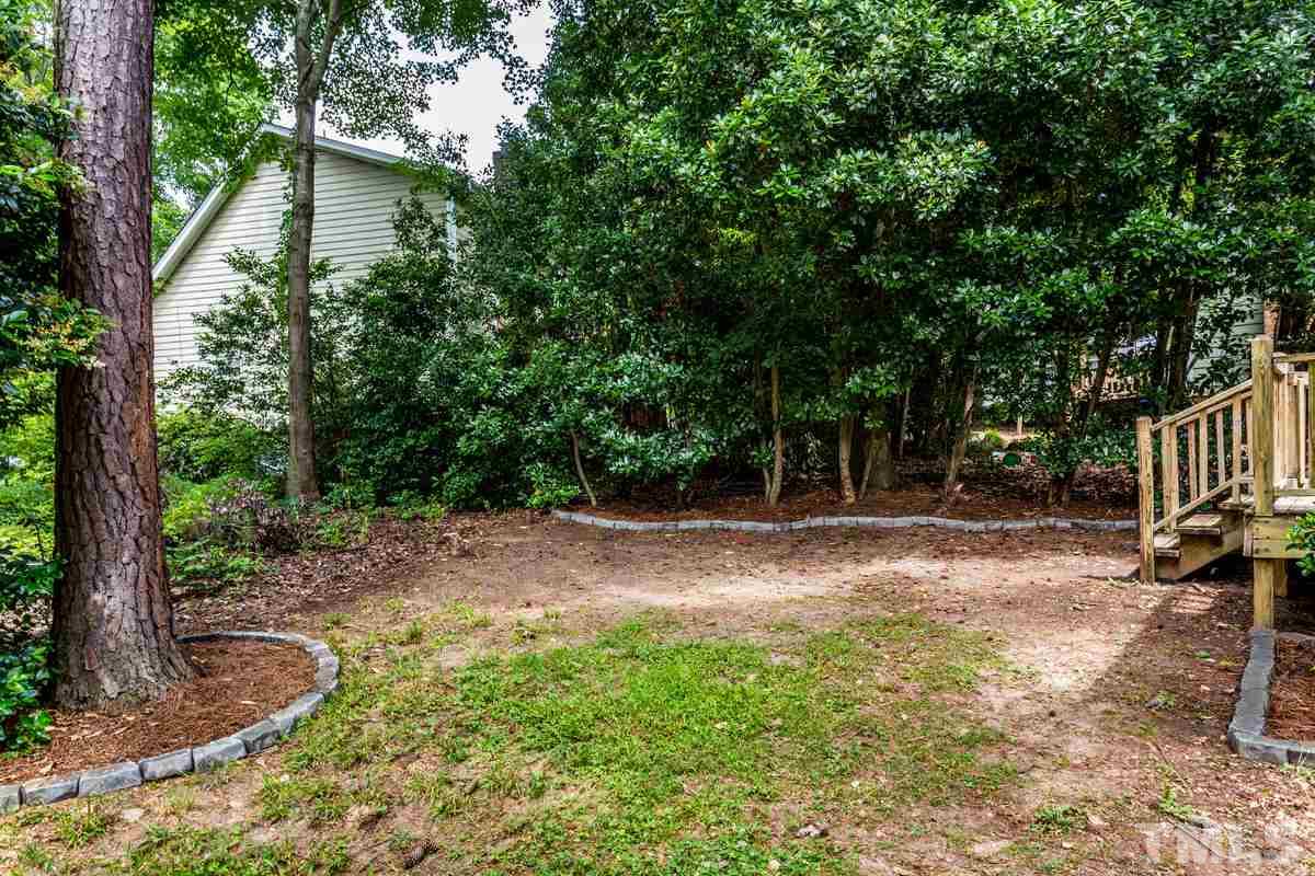 6908 Sandringham Drive Raleigh, NC 27613 - Photo 20 of 21 a view of outdoor space and yard
