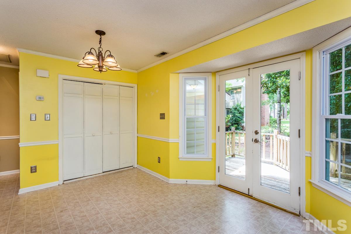 6908 Sandringham Drive Raleigh, NC 27613 - Photo 9 of 21 a view of an empty room with a window