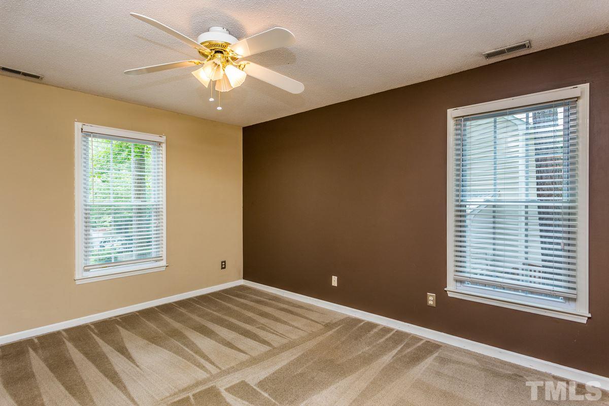 6908 Sandringham Drive Raleigh, NC 27613 - Photo 10 of 21 a view of an empty room with a window