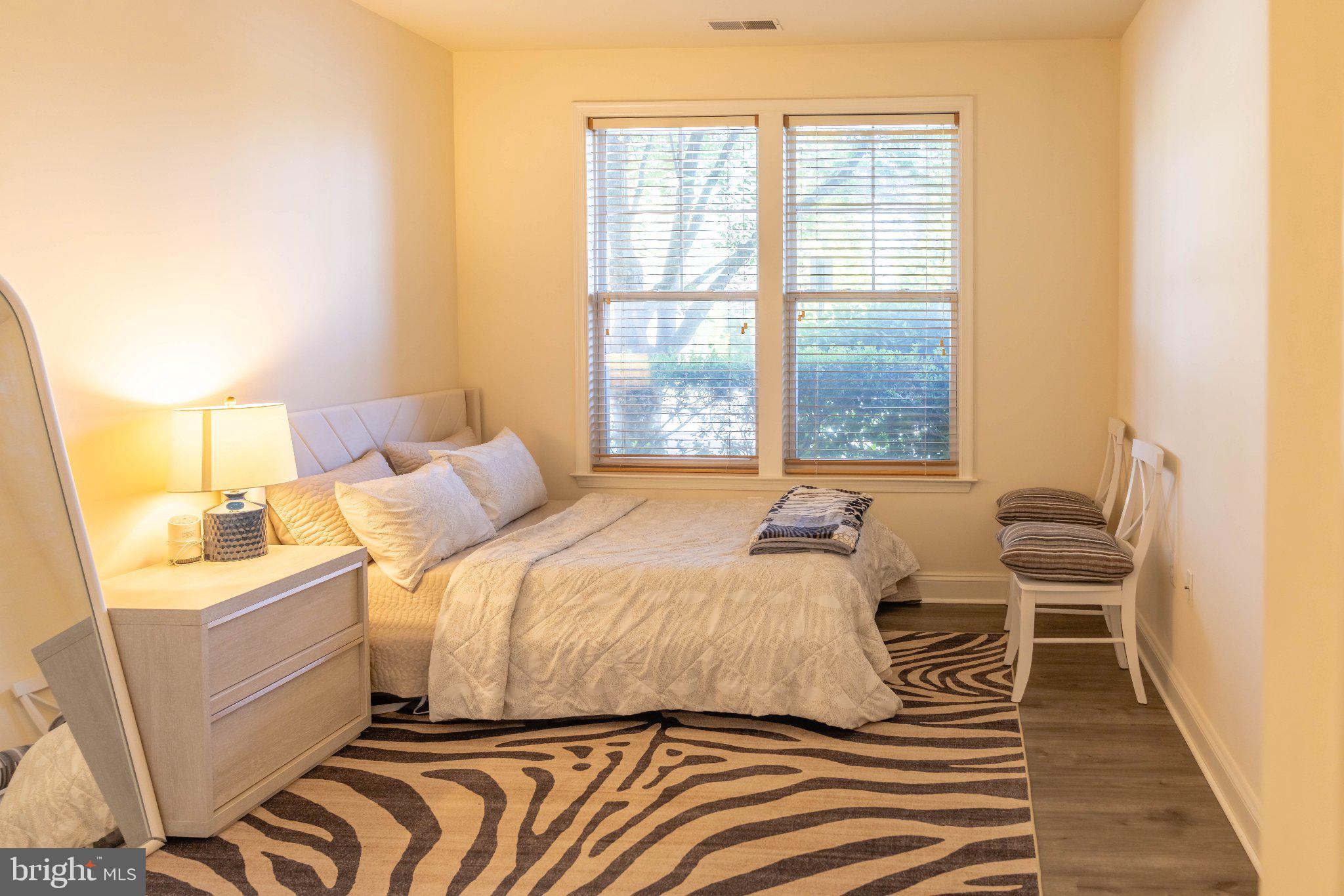 12824 Clarksburg Square Road, Unit 105 Clarksburg, MD 20871 - Photo 57 of 96 Serene bedroom with natural light.