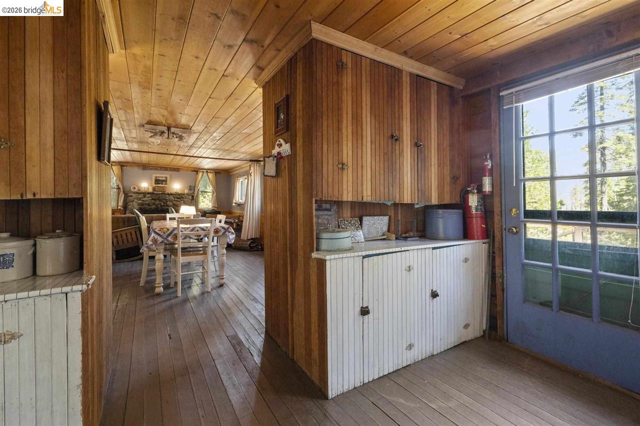 7 Riverside Tract Kyburz, CA 95720 - Photo 7 of 25 a room with wooden floors and furniture