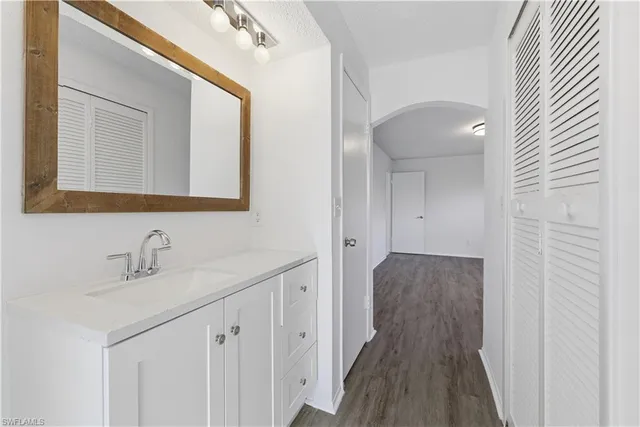 a bathroom with a sink and a mirror